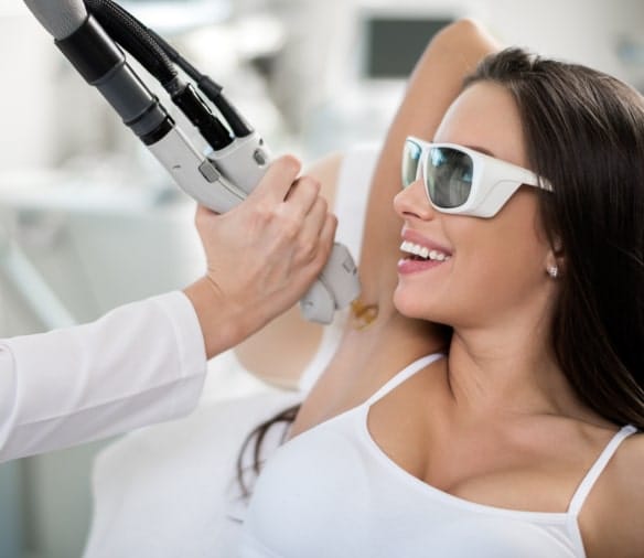 Smiley lady is doing laser hair removal