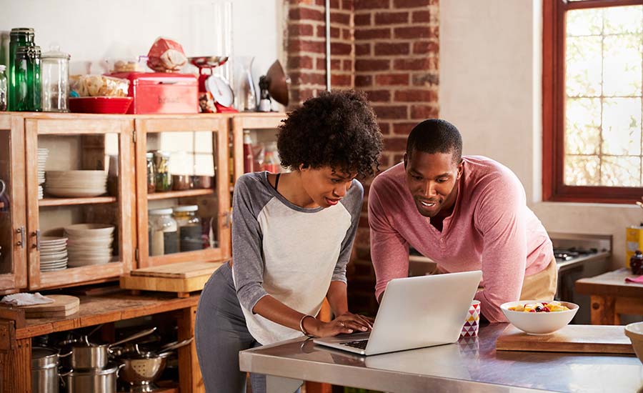 A young couple using a laptop​