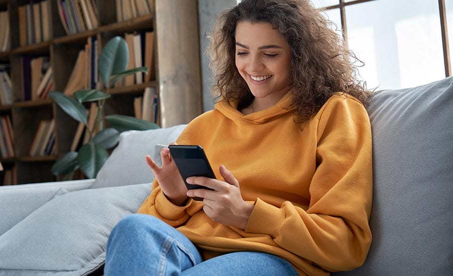 A young woman wearing a sweater​